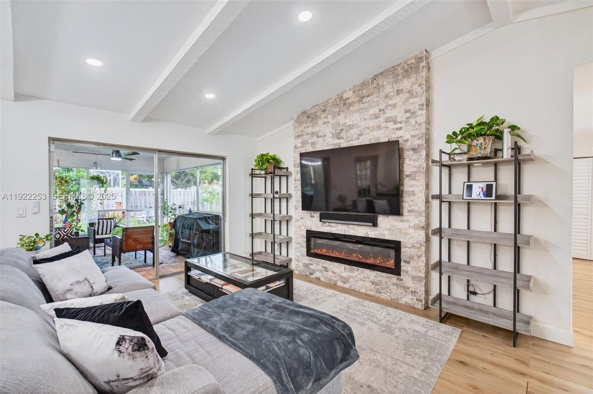 Fireplace, Interior, Living room, Recessed Lighting, Stone Walls, Wood Texture Flooring