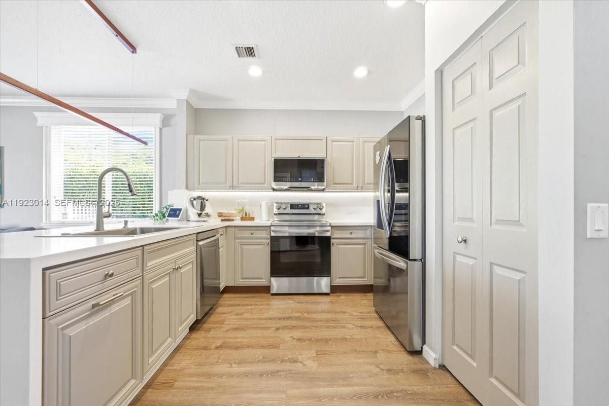 Interior, Kitchen, Recessed Lighting, Stainless Steel Appliances, Wood Texture Flooring