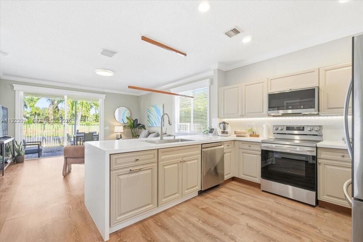 Interior, Kitchen, Recessed Lighting, Stainless Steel Appliances, Wood Texture Flooring