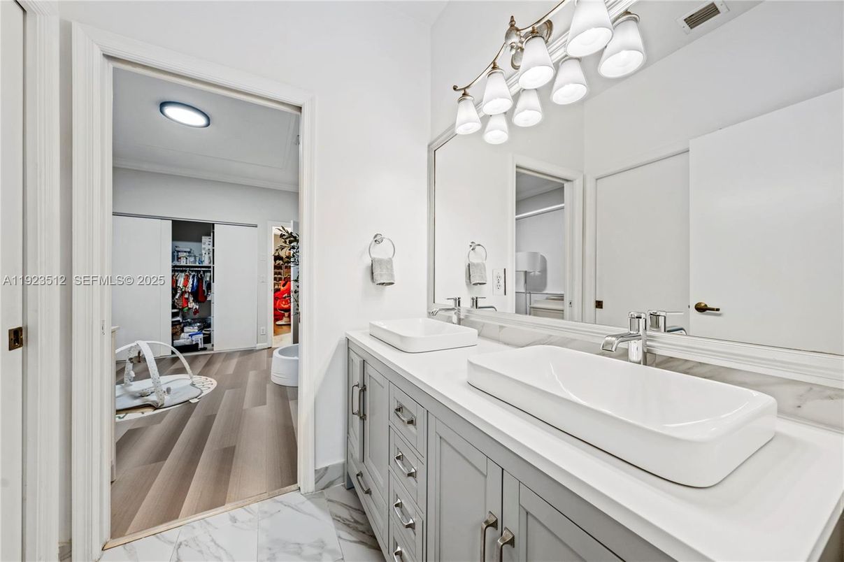 Bathroom, Dual Sink Vanities, Interior, Marble, Recessed Lighting, Walk-in Closets, Wood Texture Flooring