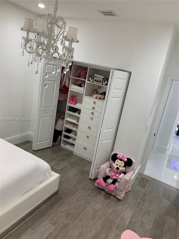 Bedroom, Chandelier, Interior, Marble, Recessed Lighting, Walk-in Closets, Wood Texture Flooring