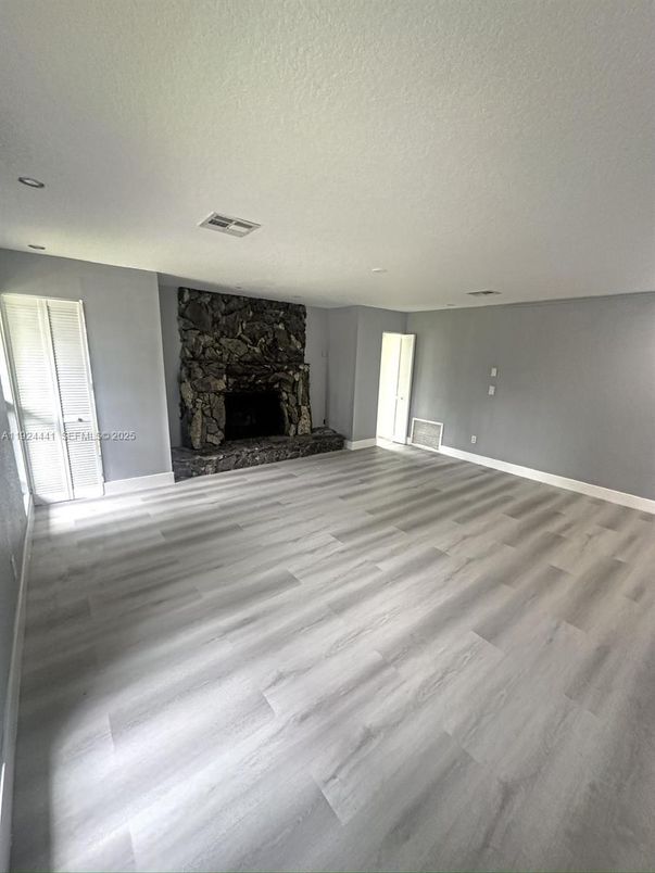 Empty room, Fireplace, Interior, Stone Walls, Wood Texture Flooring