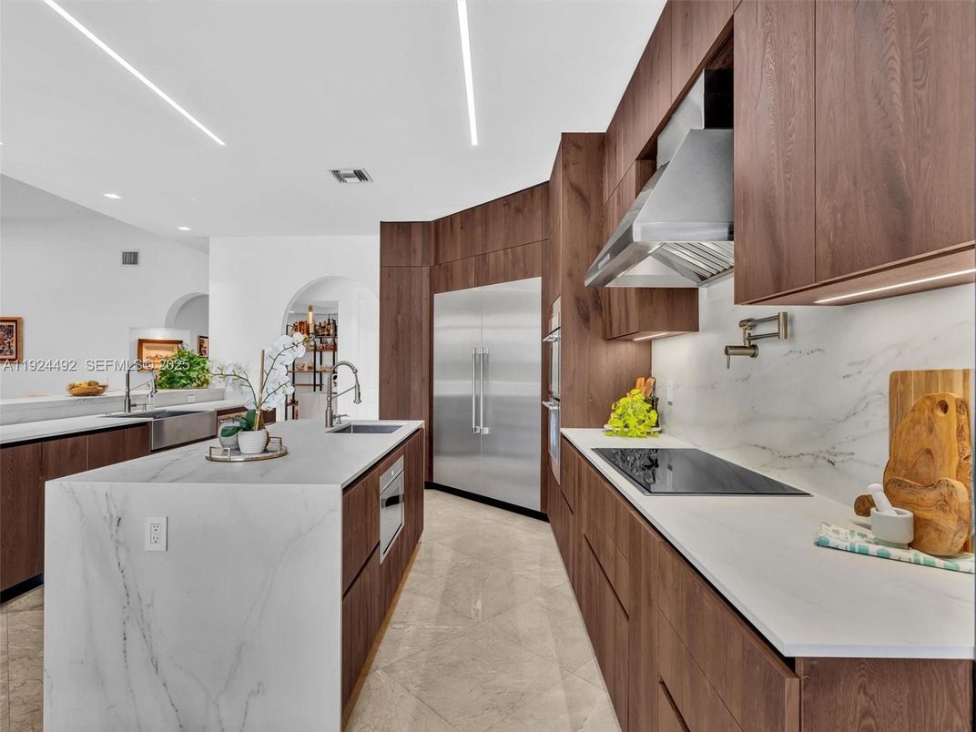 Interior, Kitchen, Marble Walls, Recessed Lighting, Stainless Steel Appliances