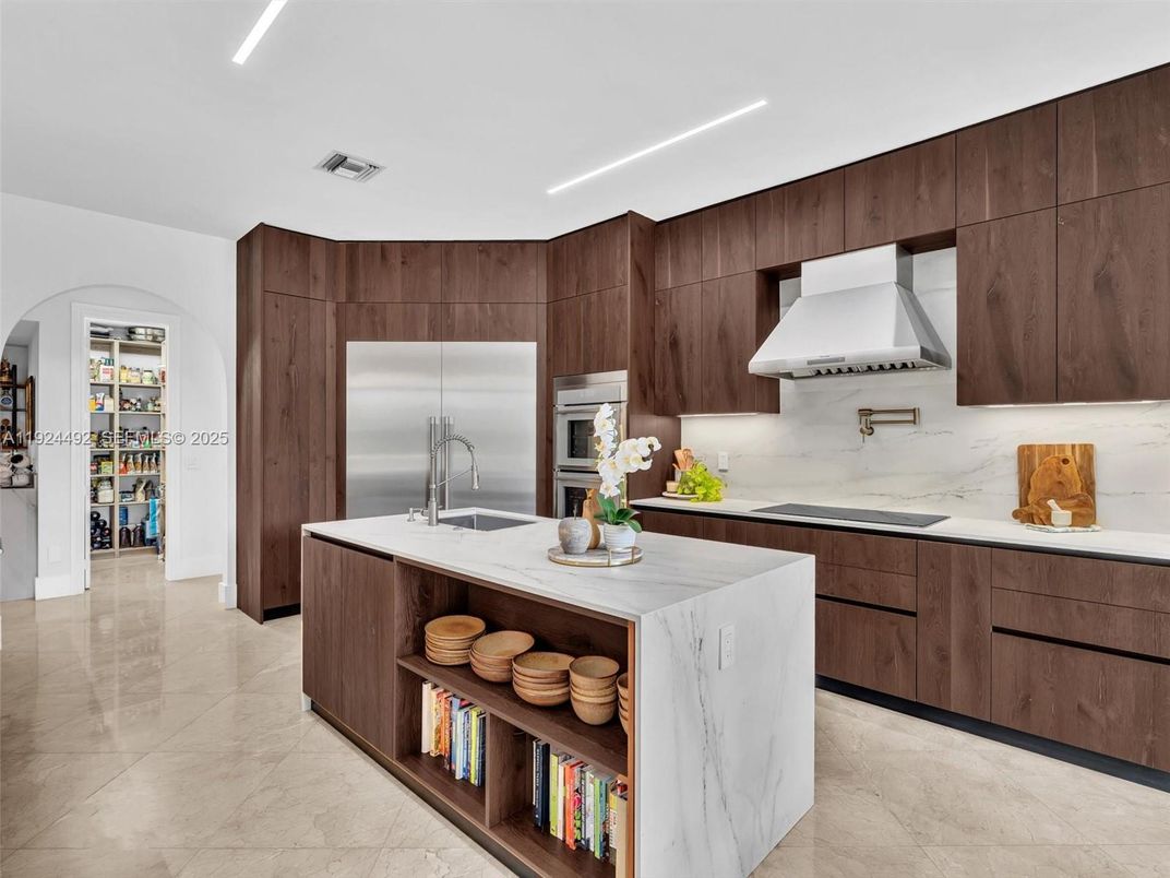 Interior, Kitchen, Marble Walls, Recessed Lighting, Stainless Steel Appliances