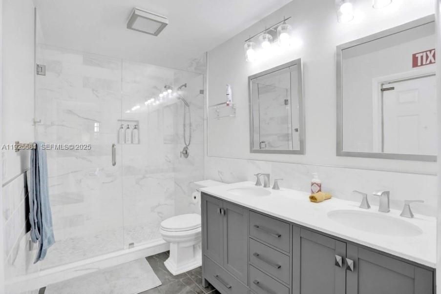 Bathroom, Dual Sink Vanities, Glass Shower, Interior, Marble Walls