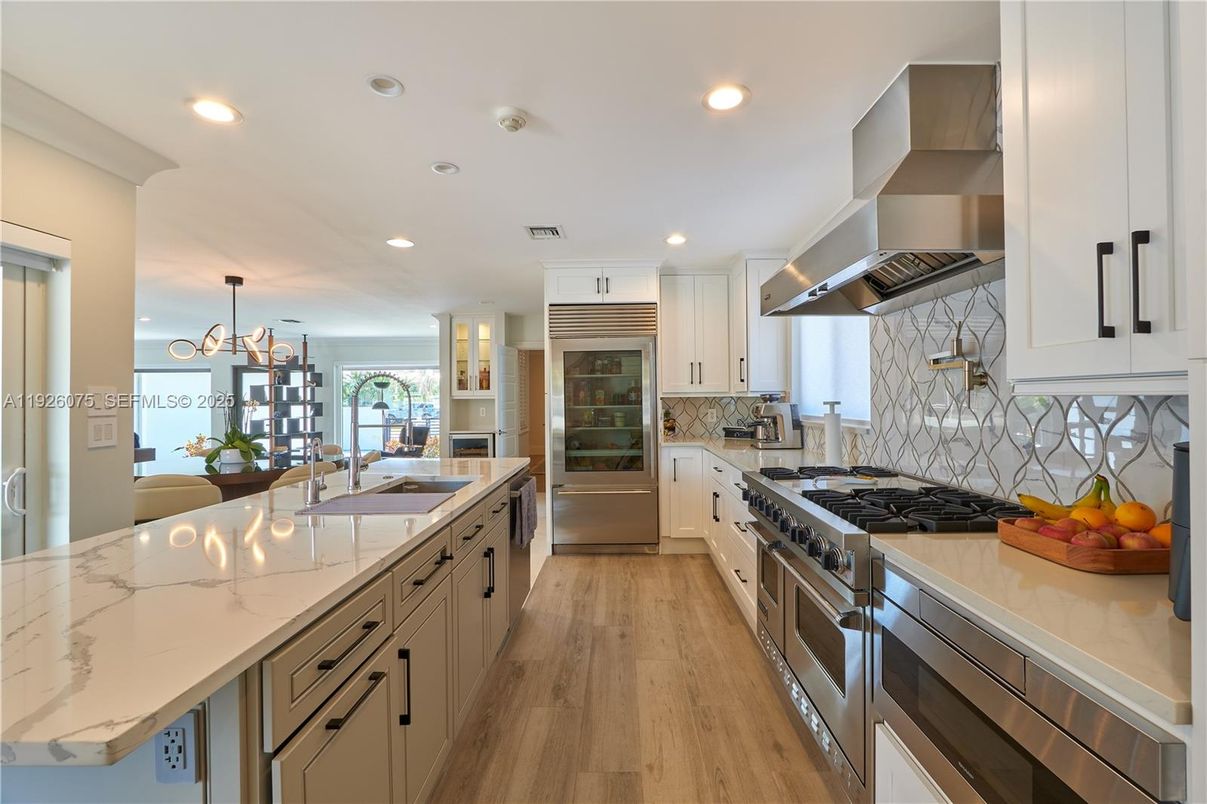 Chandelier, Interior, Kitchen, Pendant Lights, Recessed Lighting, Stainless Steel Appliances, Wood Texture Flooring
