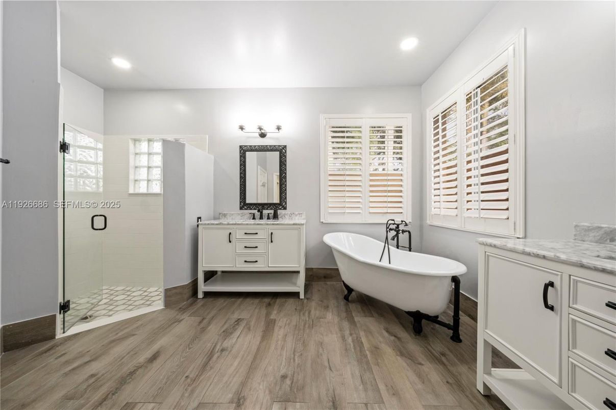 Bathroom, Dual Sink Vanities, Free Standing Baths, Glass Shower, Interior, Recessed Lighting, Wood Texture Flooring