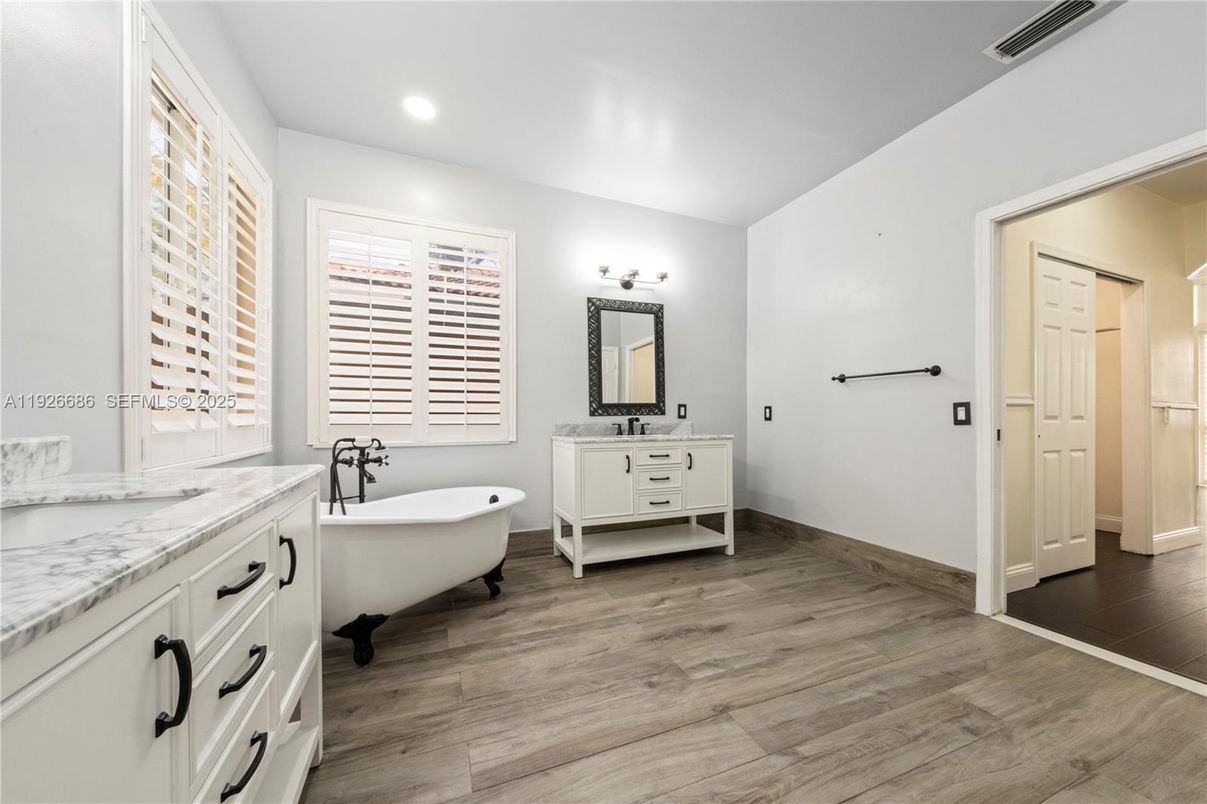 Bathroom, Dual Sink Vanities, Free Standing Baths, Interior, Recessed Lighting, Wood Texture Flooring