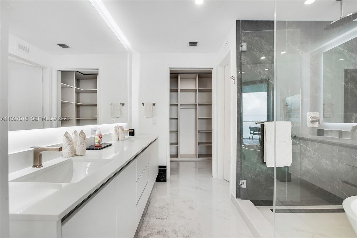 Bathroom, Dual Sink Vanities, Glass Shower, Interior, Marble, Recessed Lighting, Walk-in Closets
