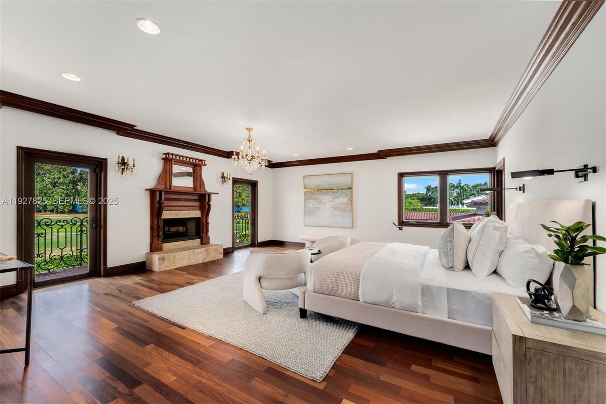 Bedroom, Chandelier, Fireplace, Interior, Recessed Lighting, Wood Texture Flooring