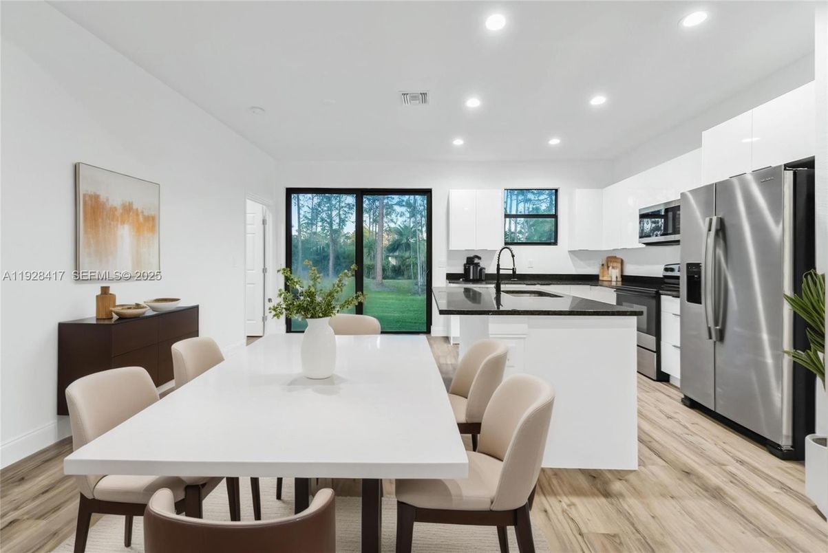 Dining room, Interior, Kitchen, Recessed Lighting, Stainless Steel Appliances, Wood Texture Flooring