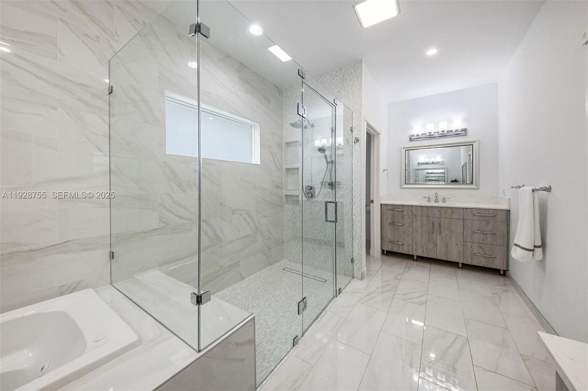 Bathroom, Dual Sink Vanities, Glass Shower, Interior, Marble, Marble Walls, Recessed Lighting