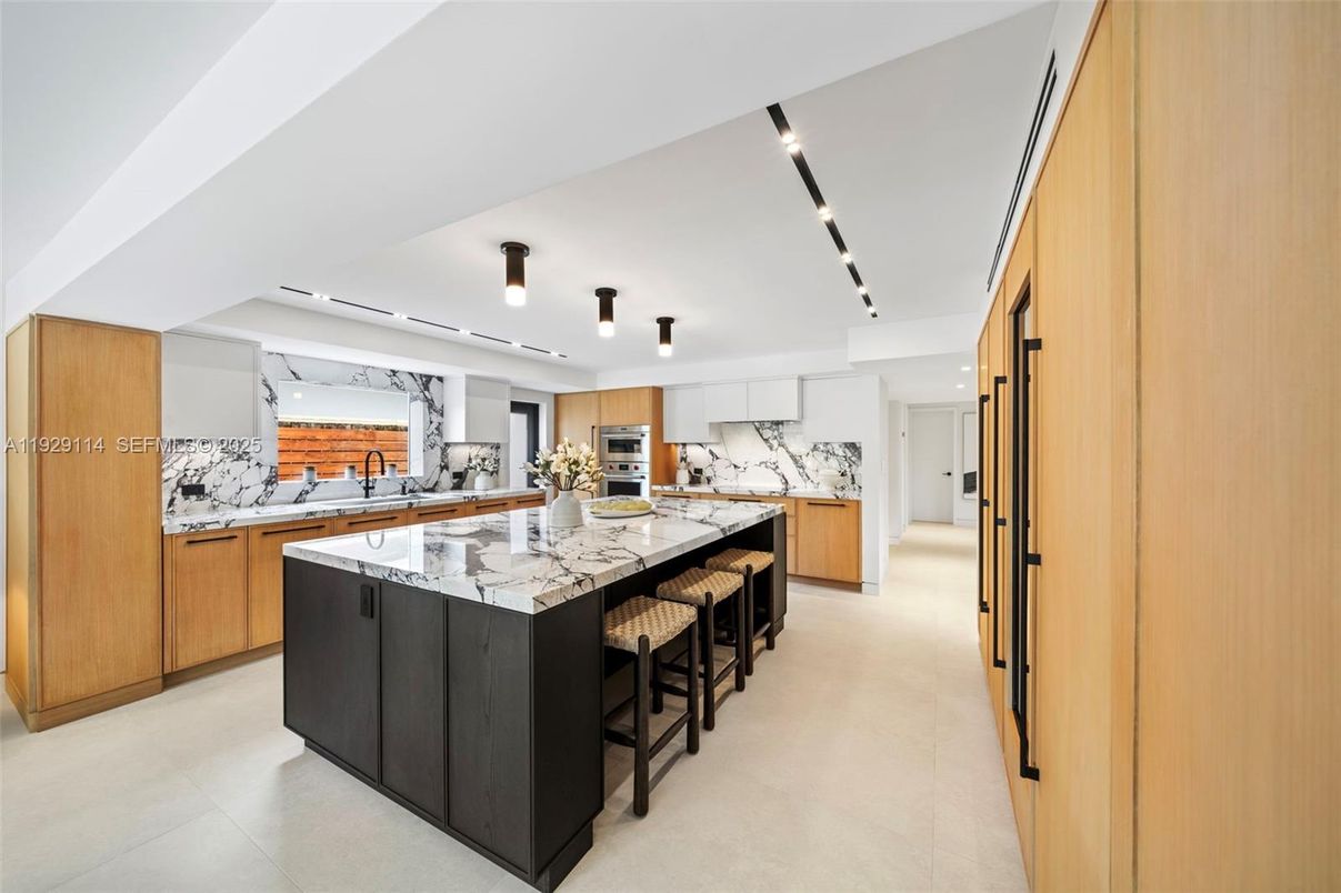 Interior, Kitchen, Marble Walls, Recessed Lighting, Stainless Steel Appliances