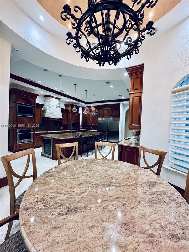 Chandelier, Dining room, Interior, Kitchen, Pendant Lights, Recessed Lighting, Stainless Steel Appliances