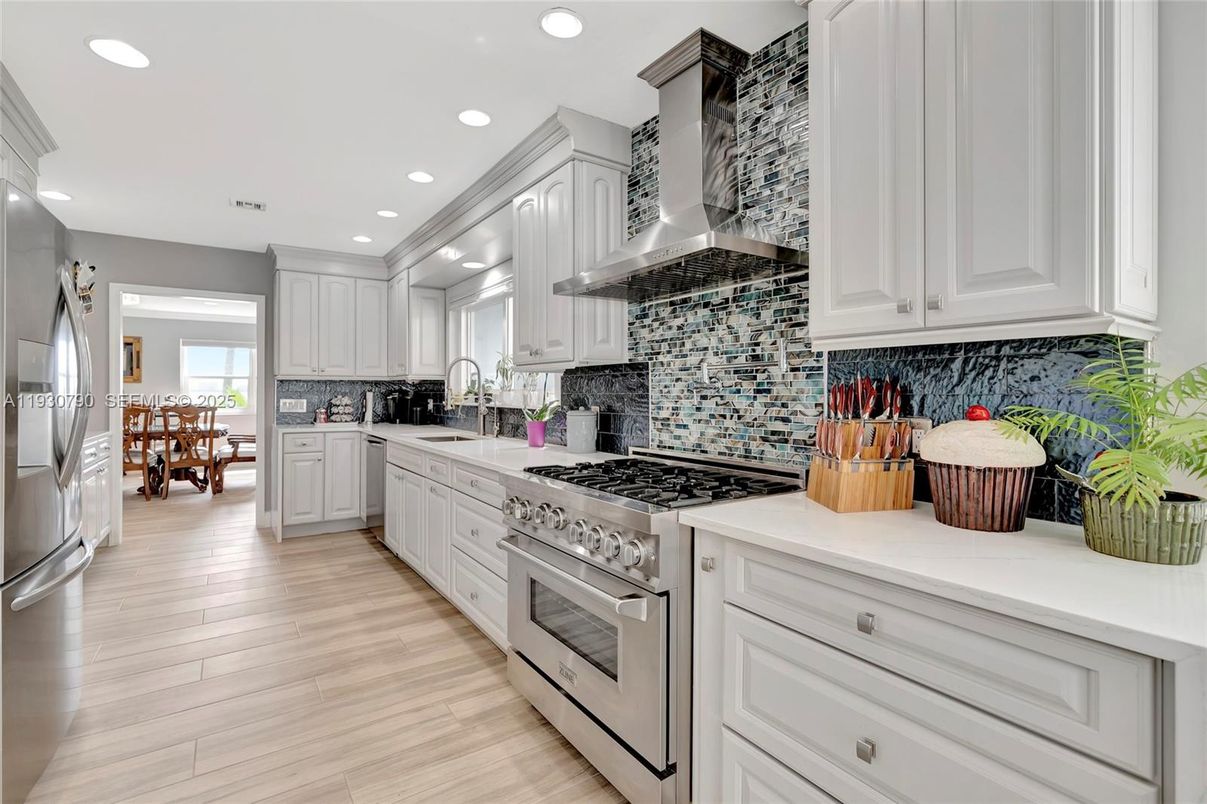 Dining room, Interior, Kitchen, Recessed Lighting, Stainless Steel Appliances, Wood Texture Flooring
