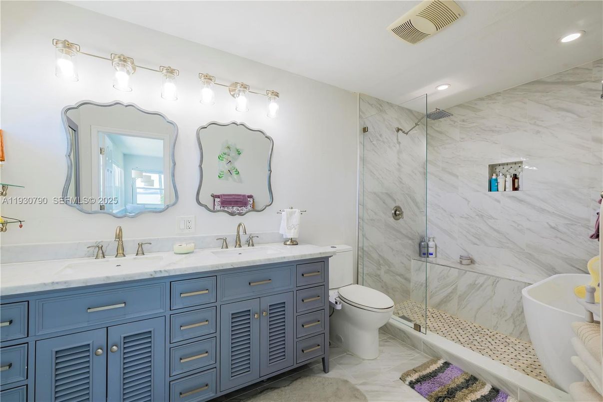 Bathroom, Dual Sink Vanities, Free Standing Baths, Glass Shower, Interior, Marble, Marble Walls, Recessed Lighting