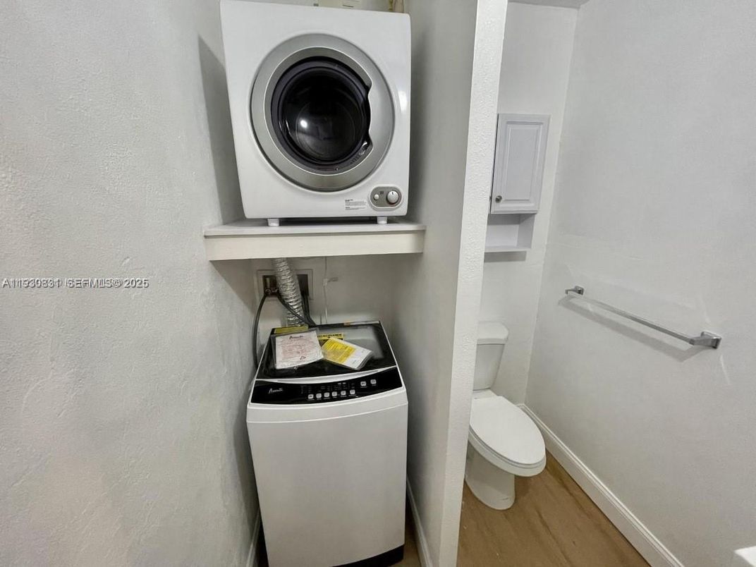 Bathroom, Interior, Utility Closets, Washer, Wood Texture Flooring