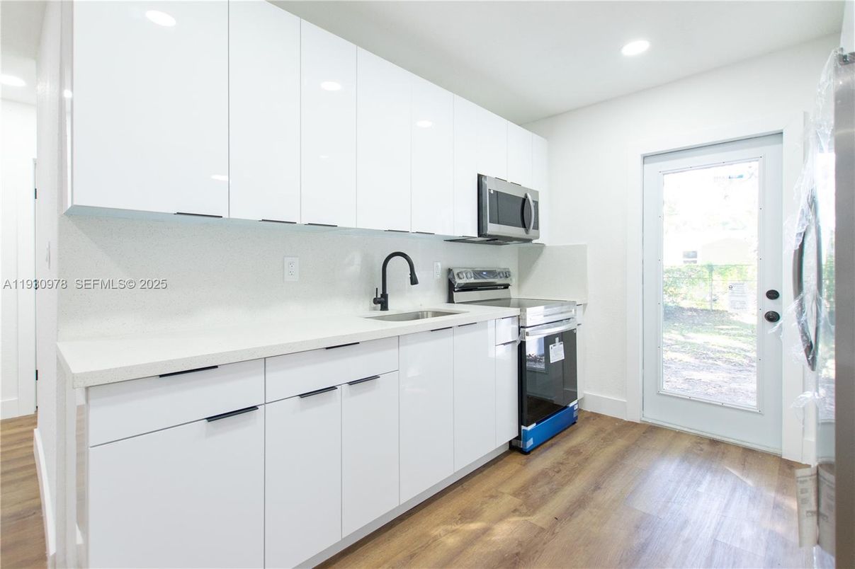 Interior, Kitchen, Recessed Lighting, Stainless Steel Appliances, Wood Texture Flooring