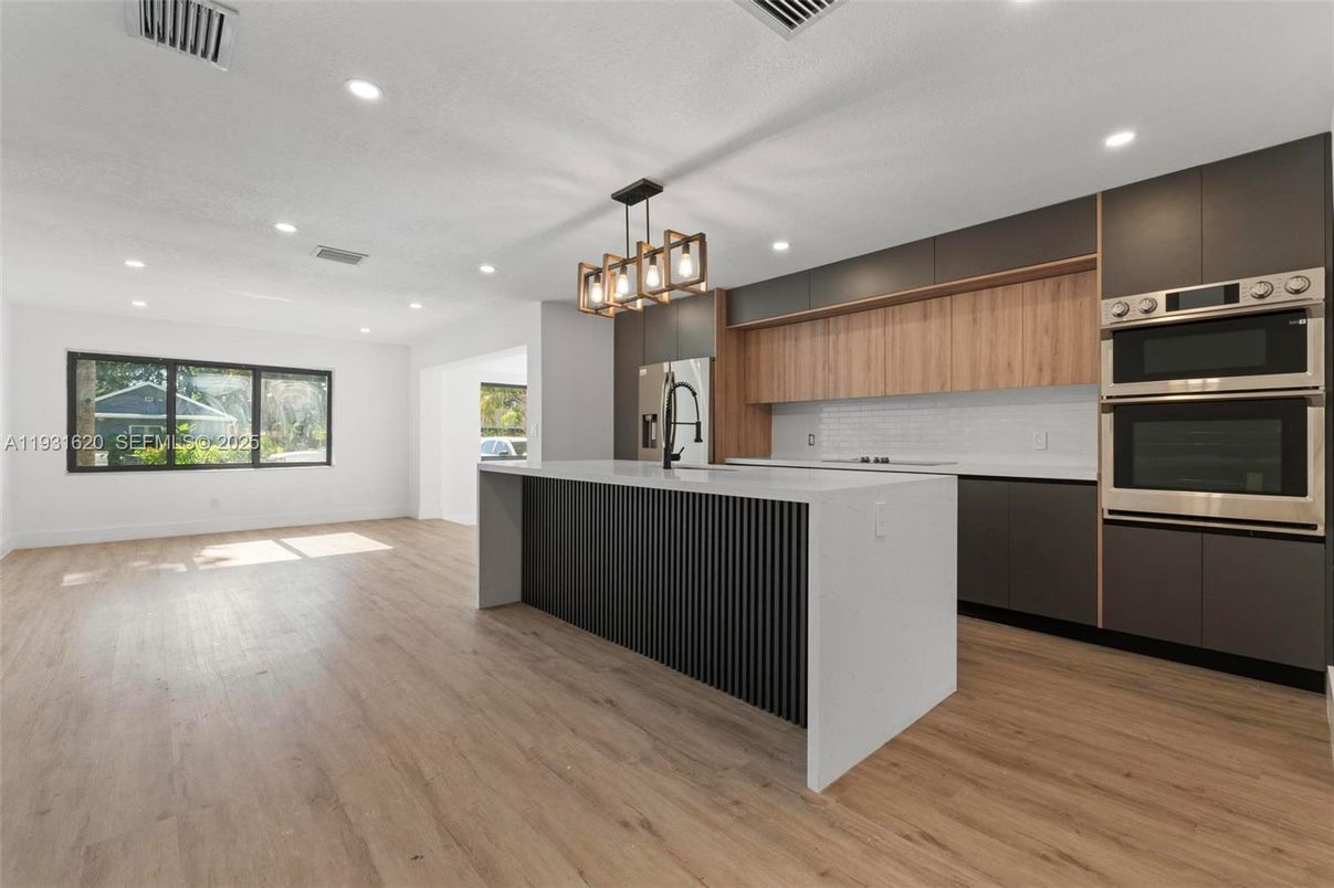 Chandelier, Interior, Kitchen, Pendant Lights, Recessed Lighting, Stainless Steel Appliances, Wood Texture Flooring