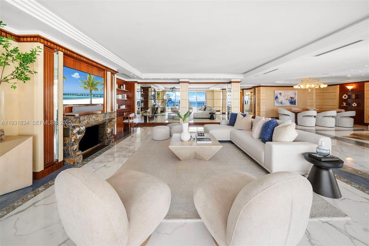 Chandelier, Fireplace, Interior, Living room, Marble, Recessed Lighting, Water, Wooden Walls