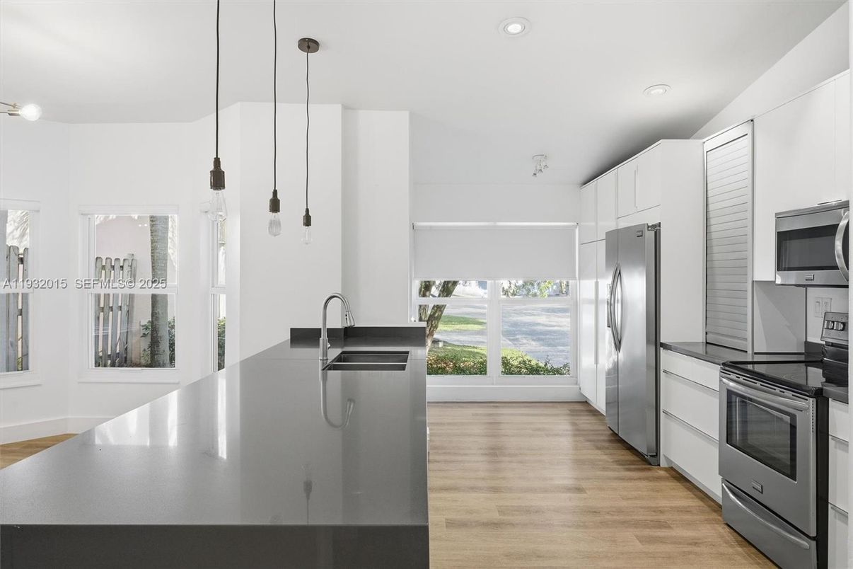 Interior, Kitchen, Pendant Lights, Recessed Lighting, Stainless Steel Appliances, Wood Texture Flooring