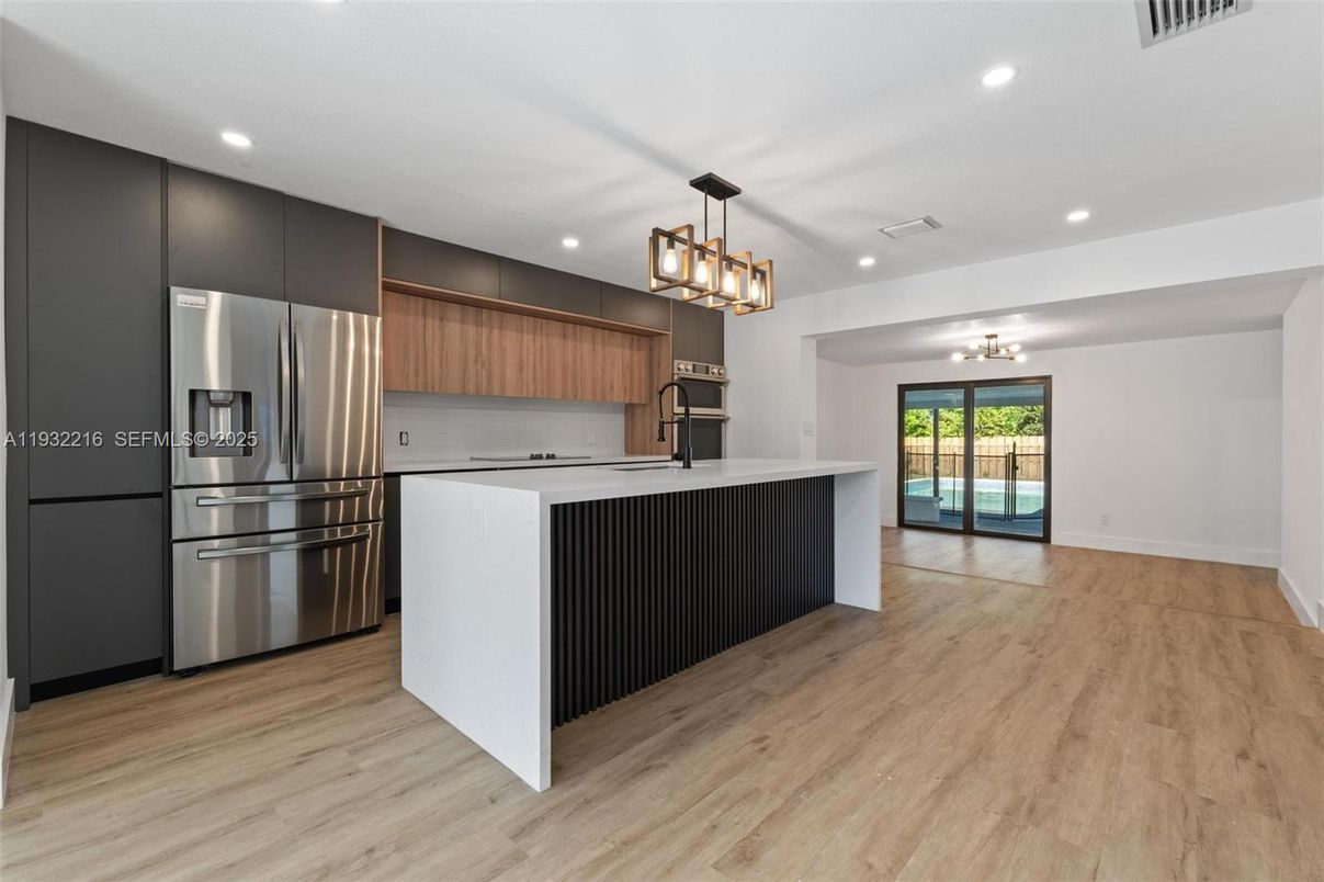 Chandelier, Interior, Kitchen, Recessed Lighting, Stainless Steel Appliances, Wood Texture Flooring