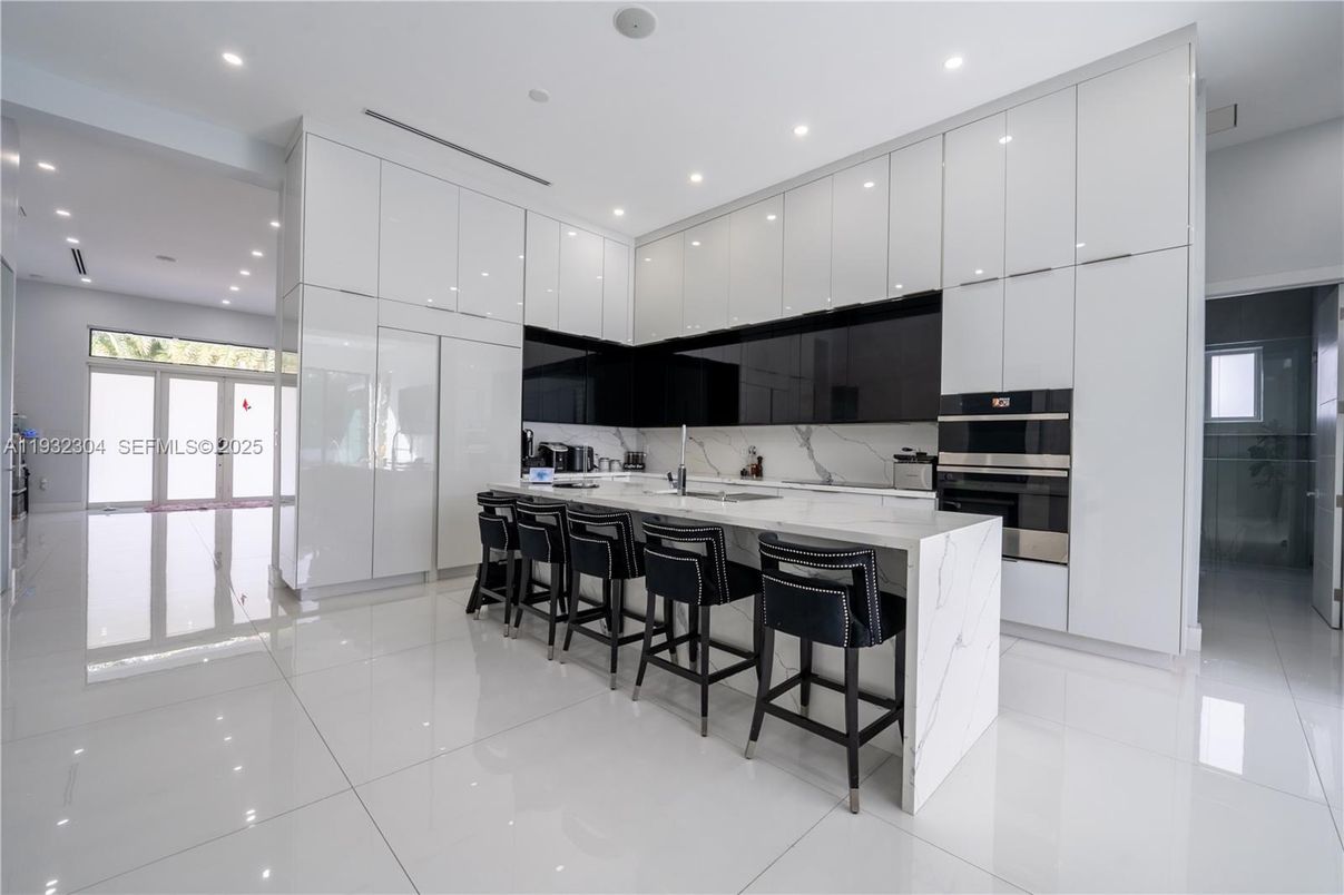 Interior, Kitchen, Marble Walls, Recessed Lighting, Stainless Steel Appliances