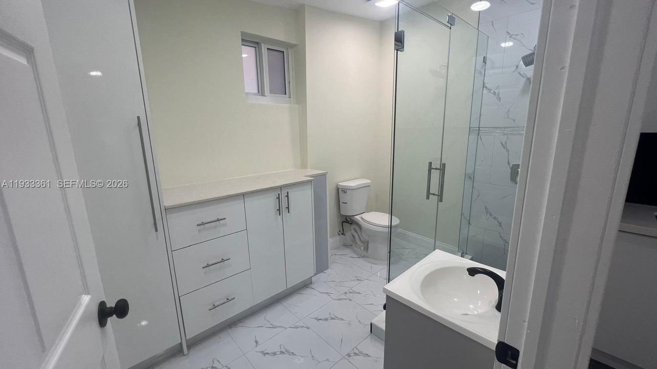 Bathroom, Dual Sink Vanities, Glass Shower, Interior, Marble, Marble Walls, Recessed Lighting