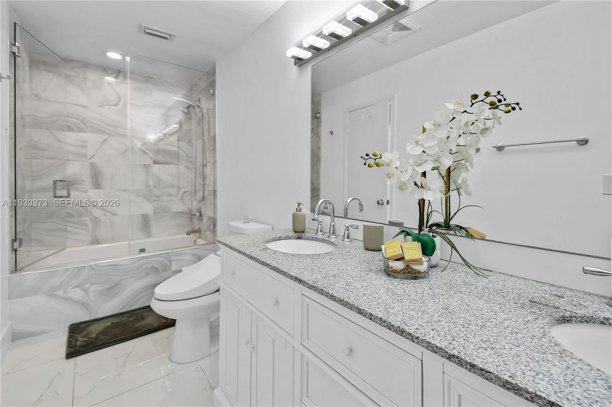 Bathroom, Dual Sink Vanities, Glass Shower, Interior, Marble, Marble Walls, Recessed Lighting