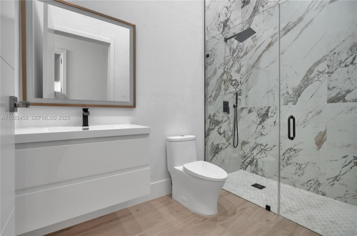 Bathroom, Glass Shower, Interior, Marble Walls, Wood Texture Flooring