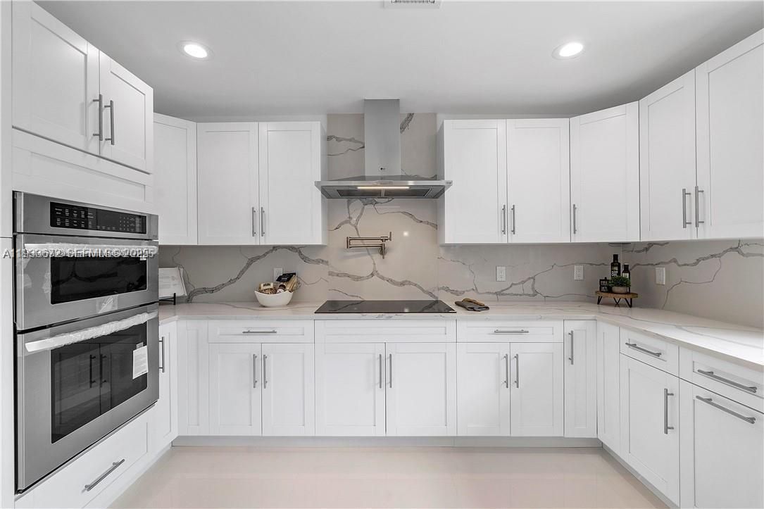 Interior, Kitchen, Marble Walls, Recessed Lighting, Stainless Steel Appliances