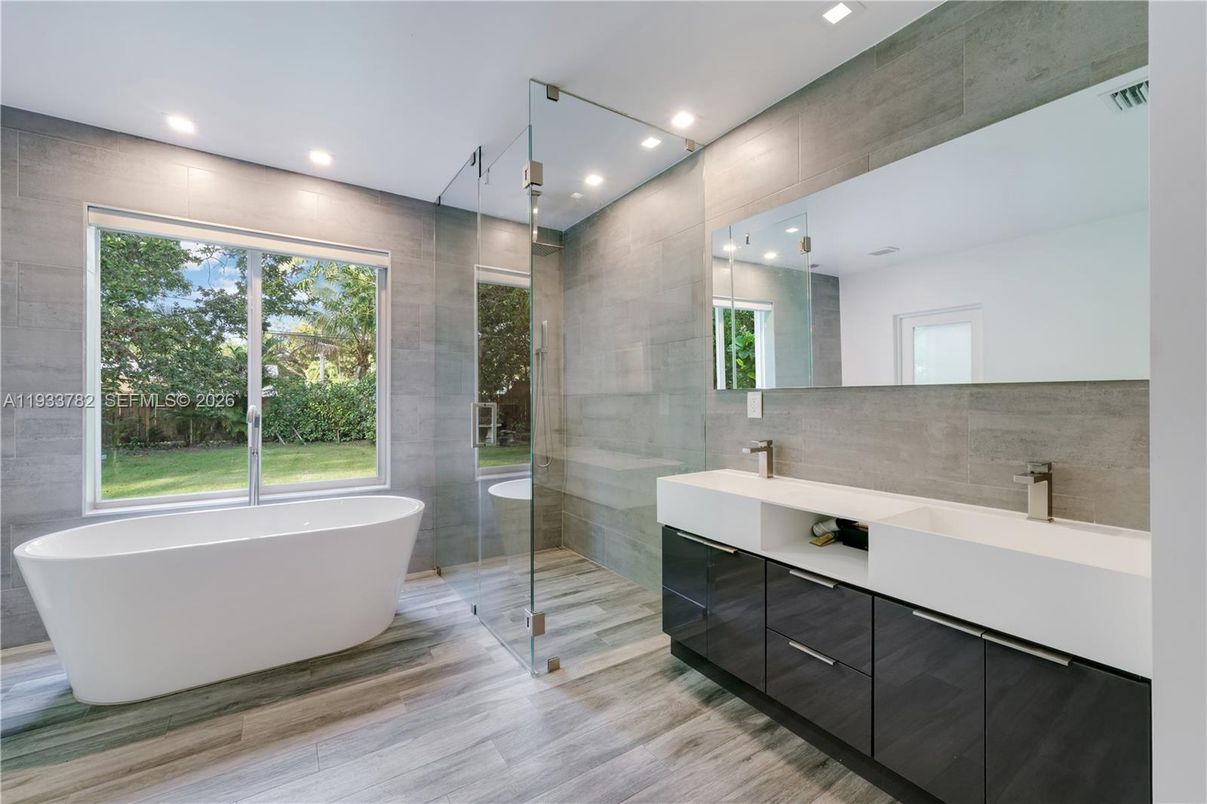 Bathroom, Dual Sink Vanities, Free Standing Baths, Glass Shower, Interior, Recessed Lighting, Wood Texture Flooring