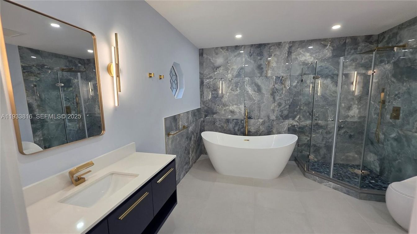 Bathroom, Dual Sink Vanities, Free Standing Baths, Glass Shower, Interior, Marble Walls, Recessed Lighting