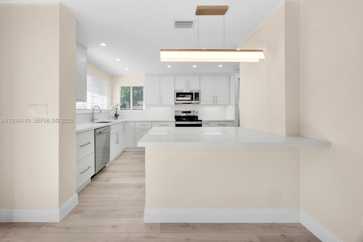 Interior, Kitchen, Pendant Lights, Recessed Lighting, Stainless Steel Appliances, Wood Texture Flooring