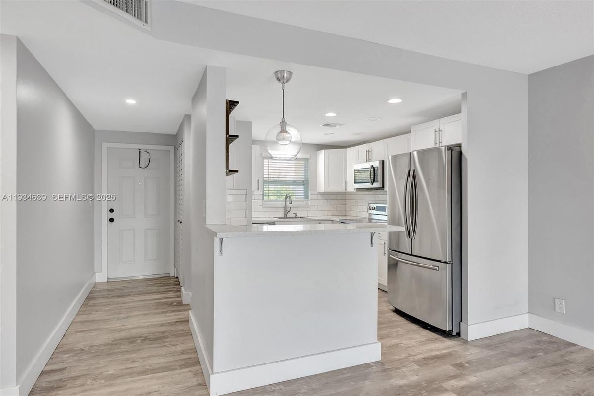 Interior, Kitchen, Pendant Lights, Recessed Lighting, Stainless Steel Appliances, Wood Texture Flooring