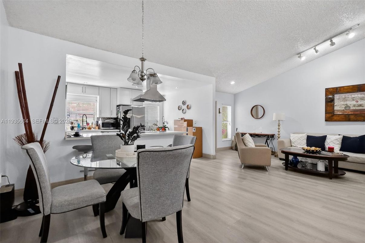 Dining room, Interior, Kitchen, Living room, Pendant Lights, Recessed Lighting, Stainless Steel Appliances, Wood Texture Flooring