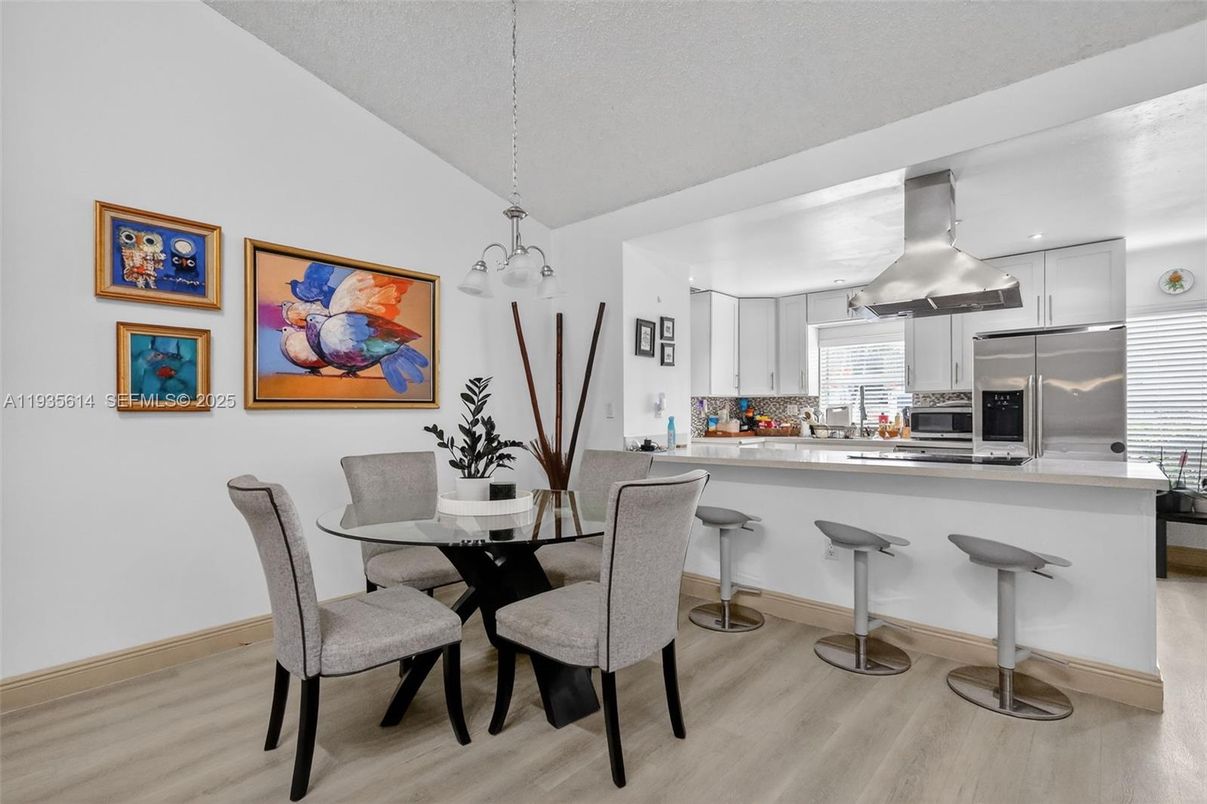 Dining room, Interior, Kitchen, Pendant Lights, Recessed Lighting, Stainless Steel Appliances, Wood Texture Flooring