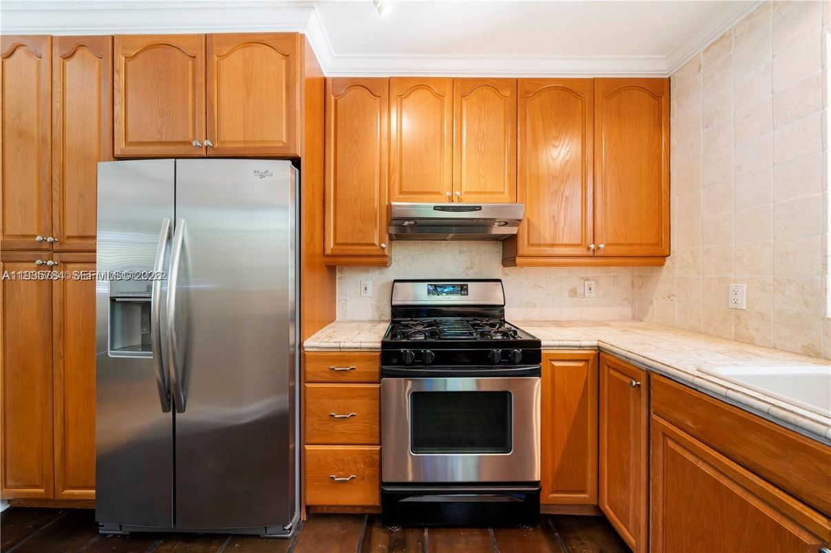 Interior, Kitchen, Stainless Steel Appliances, Tile Countertops, Wood Texture Flooring