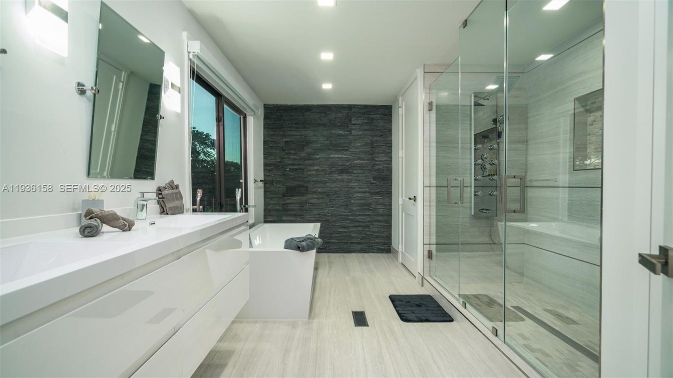 Bathroom, Dual Sink Vanities, Free Standing Baths, Glass Shower, Interior, Recessed Lighting, Wood Texture Flooring