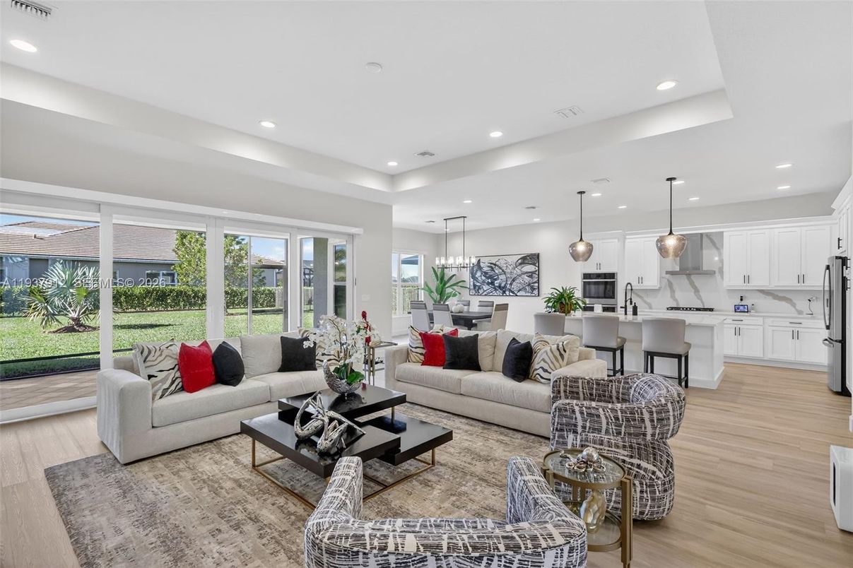 Dining room, Interior, Kitchen, Living room, Marble Walls, Pendant Lights, Recessed Lighting, Stainless Steel Appliances, Wood Texture Flooring