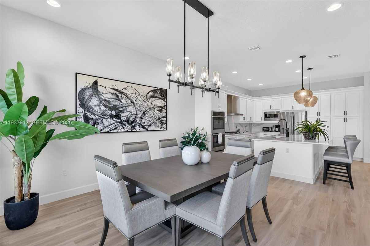 Dining room, Interior, Kitchen, Pendant Lights, Recessed Lighting, Stainless Steel Appliances, Wood Texture Flooring