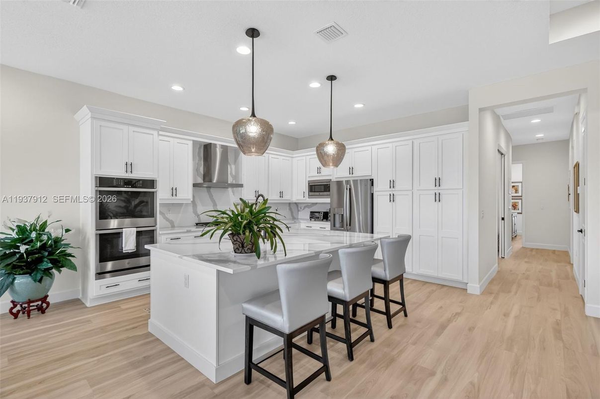 Interior, Kitchen, Pendant Lights, Recessed Lighting, Stainless Steel Appliances, Wood Texture Flooring