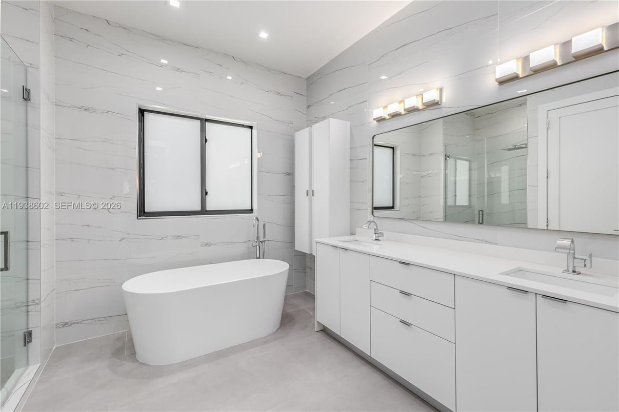 Bathroom, Dual Sink Vanities, Free Standing Baths, Glass Shower, Interior, Marble Walls, Recessed Lighting