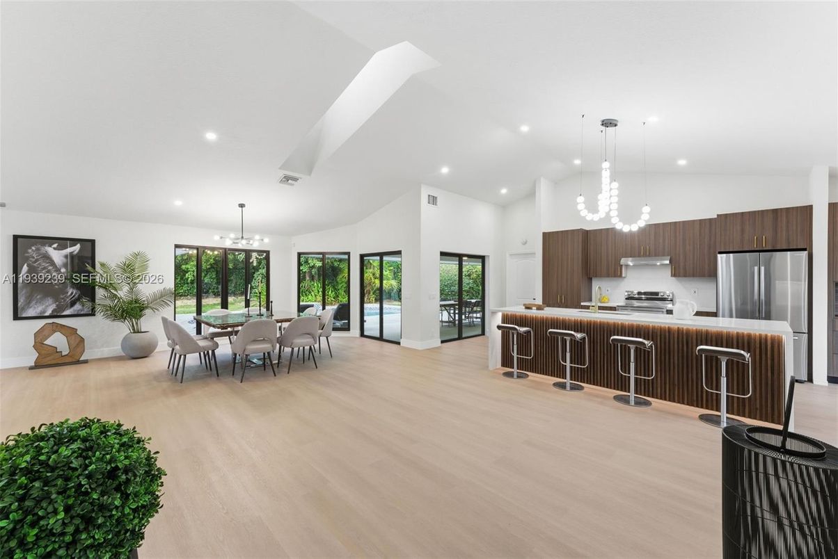 Chandelier, Dining room, Interior, Kitchen, Pendant Lights, Recessed Lighting, Stainless Steel Appliances, Wood Texture Flooring