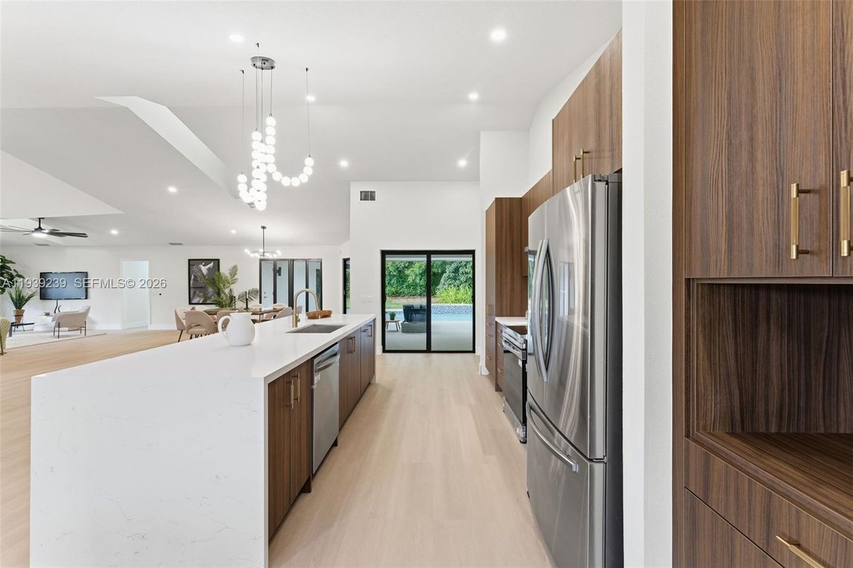 Dining room, Interior, Kitchen, Pendant Lights, Recessed Lighting, Stainless Steel Appliances, Wood Texture Flooring