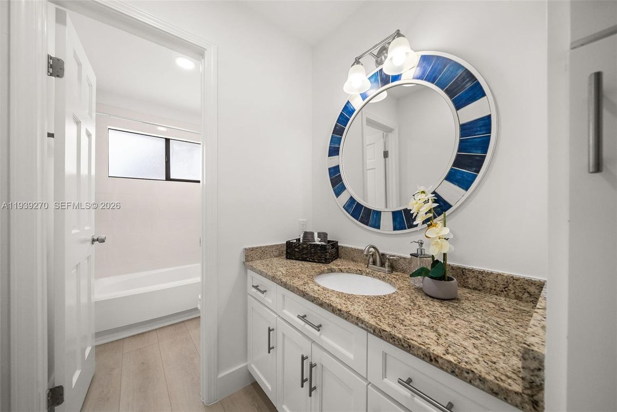 Bathroom, Dual Sink Vanities, Interior, Recessed Lighting, Wood Texture Flooring