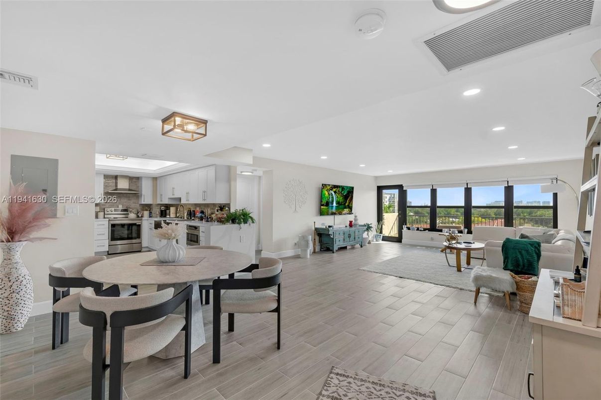 Dining room, Interior, Kitchen, Living room, Recessed Lighting, Stainless Steel Appliances, Wood Texture Flooring