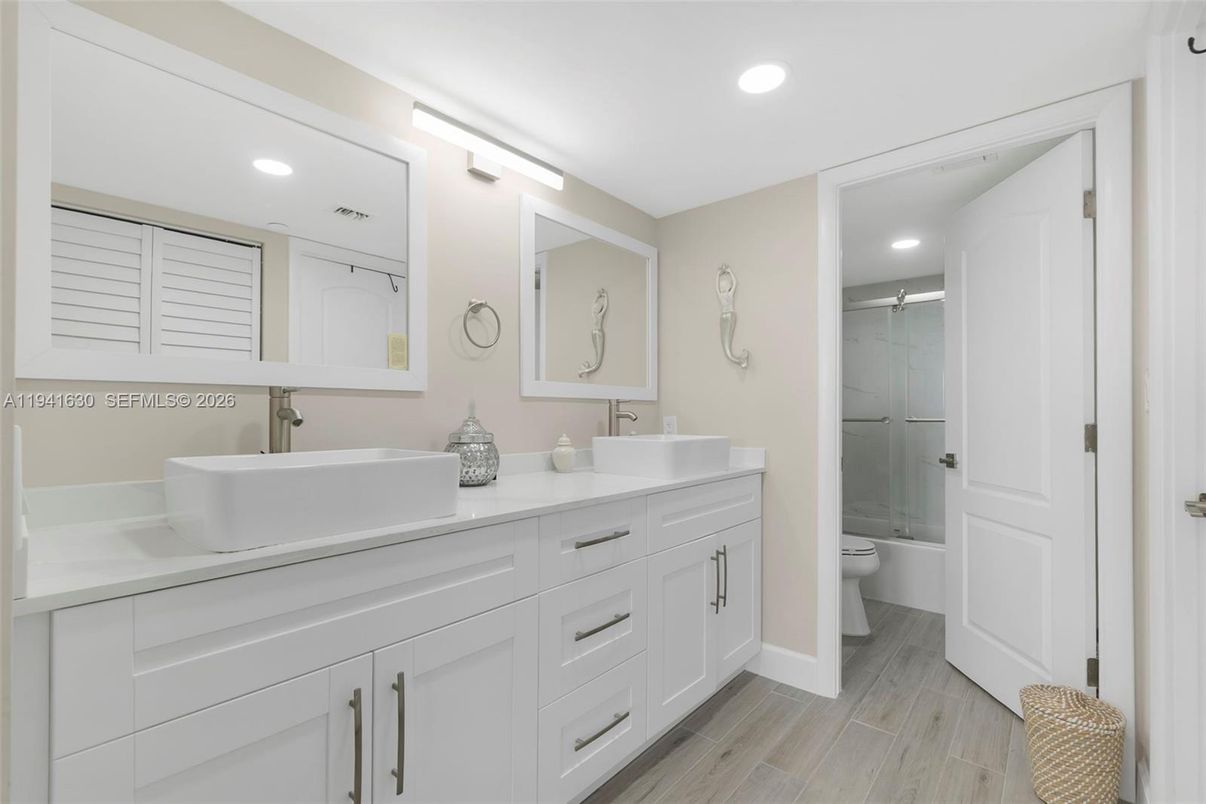 Bathroom, Dual Sink Vanities, Glass Shower, Interior, Recessed Lighting, Wood Texture Flooring