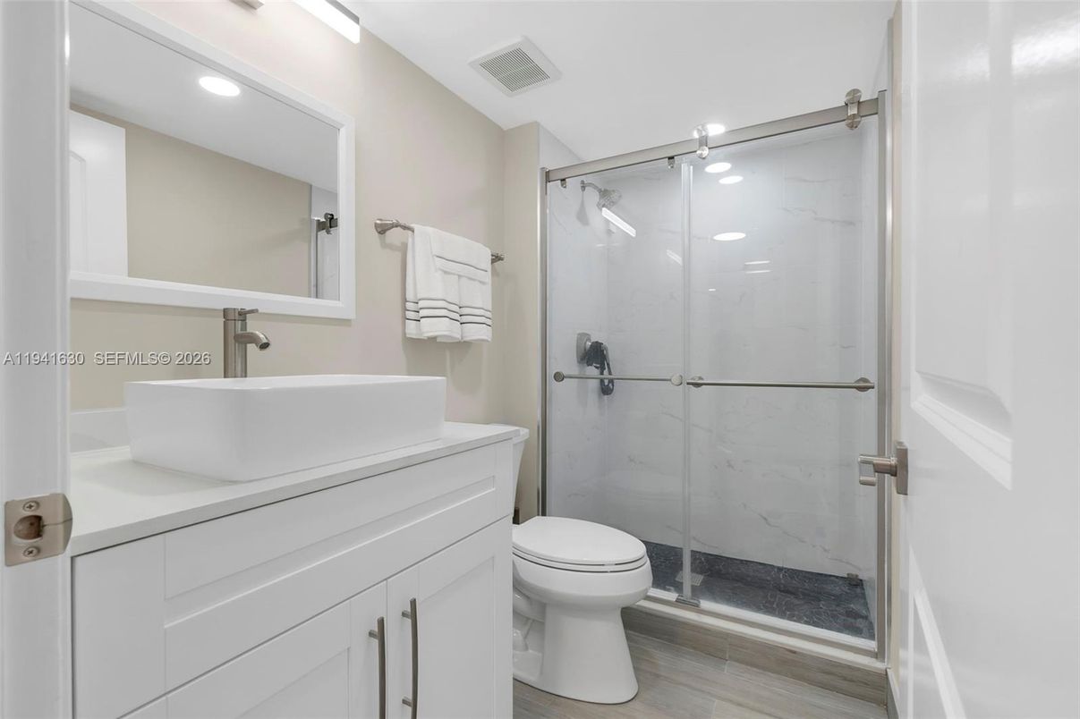 Bathroom, Glass Shower, Interior, Marble Walls, Recessed Lighting, Wood Texture Flooring