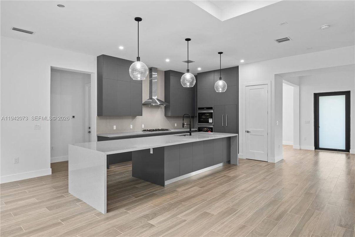 Interior, Kitchen, Pendant Lights, Recessed Lighting, Stainless Steel Appliances, Wood Texture Flooring
